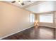 Cozy living room featuring hardwood floors and natural light from the large windows at 2718 S Hazel Ct, Denver, CO 80236