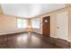 Living room featuring hardwood floors, a large window, and neutral paint throughout at 2718 S Hazel Ct, Denver, CO 80236