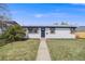 A charming home with a neatly trimmed lawn and inviting pathway at 4507 W 2Nd Ave, Denver, CO 80219