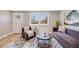 Inviting living room with a large window providing natural light and stylish decor at 4507 W 2Nd Ave, Denver, CO 80219
