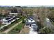 Birds-eye view of the property, featuring the house, green lawns, and mature trees at 11885 W Katherine Ave, Lakewood, CO 80401