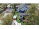 Aerial view of the house and backyard, featuring a hot tub, a patio, and landscaping at 11885 W Katherine Ave, Lakewood, CO 80401