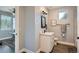 Stylish bathroom featuring a modern vanity, sleek fixtures, and trendy decor in a contemporary design at 11885 W Katherine Ave, Lakewood, CO 80401