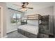 Comfortable bedroom with a bunk bed and a large window at 11885 W Katherine Ave, Lakewood, CO 80401