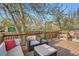 Relaxing deck space with comfortable seating and a beautiful view of the nature around the property at 11885 W Katherine Ave, Lakewood, CO 80401