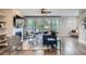Comfortable living room with large windows, hardwood floors, fireplace, and stylish decor at 11885 W Katherine Ave, Lakewood, CO 80401