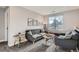 Comfortable living room with modern furniture, creating a welcoming and stylish space for relaxation and entertainment at 11885 W Katherine Ave, Lakewood, CO 80401