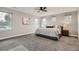 Spacious main bedroom with large windows offering ample natural light, creating a serene and inviting atmosphere at 11885 W Katherine Ave, Lakewood, CO 80401