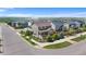 Aerial view of neighborhood that features a two-story home and sidewalks at 15100 Gaylord St, Thornton, CO 80602