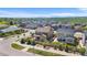 Aerial view of a sprawling community with views of the mountains in the distance at 15100 Gaylord St, Thornton, CO 80602