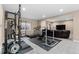 Basement featuring a home gym, treadmill, and weightlifting equipment for fitness enthusiasts at 15100 Gaylord St, Thornton, CO 80602