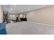 Large basement with carpet flooring, gym equipment, and ample space for various activities at 15100 Gaylord St, Thornton, CO 80602