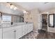 Dual sink bathroom featuring granite countertops, vanity, and walk-in shower provides luxurious comfort at 15100 Gaylord St, Thornton, CO 80602