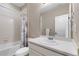 Bright bathroom featuring a shower-tub combo and a white single sink vanity at 15100 Gaylord St, Thornton, CO 80602