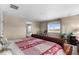 Cozy bedroom features telescope, window, and colorful bedding; perfect for a relaxing retreat at 15100 Gaylord St, Thornton, CO 80602