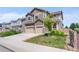 Charming two-story home with a two-car garage, inviting curb appeal, and well-manicured lawn at 15100 Gaylord St, Thornton, CO 80602