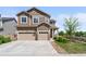 Charming two-story home with a three-car garage and manicured lawn in a suburban neighborhood at 15100 Gaylord St, Thornton, CO 80602