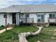 Exterior of a white house with a weathered front yard and a small porch at 15200 Holly St, Thornton, CO 80602