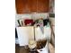 View of a laundry area with stacked washer and dryer plus storage, renovation is needed at 15200 Holly St, Thornton, CO 80602