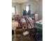 Overstuffed living room needing decluttering and renovation at 15200 Holly St, Thornton, CO 80602