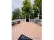 Large backyard deck perfect for outdoor entertaining with picnic table and chairs at 6973 Summerset Ave, Longmont, CO 80504