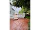 Back patio and stone path with a view of the yard at 6973 Summerset Ave, Longmont, CO 80504