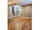 Basement with wood-look floors, recessed lighting, and bright neutral paint at 6973 Summerset Ave, Longmont, CO 80504