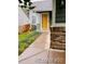 Inviting front entrance with a bright yellow door and stone accents at 6973 Summerset Ave, Longmont, CO 80504
