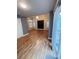 Open living room with vaulted ceiling and hardwood floors at 6973 Summerset Ave, Longmont, CO 80504