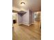 Open living room with recessed lighting, modern floors, and neutral-toned walls at 6973 Summerset Ave, Longmont, CO 80504