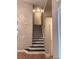 Staircase with modern railing and neutral wall paint at 6973 Summerset Ave, Longmont, CO 80504