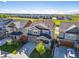 Expansive aerial view of a two-story home in a neighborhood with open fields nearby at 15608 E Otero Cir, Centennial, CO 80112