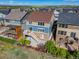 Aerial view of backyard with a patio, deck with furniture, lawn, and wooden privacy fence at 15608 E Otero Cir, Centennial, CO 80112
