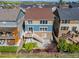 Aerial view of backyard with a patio, deck with furniture, lawn, and wooden privacy fence at 15608 E Otero Cir, Centennial, CO 80112