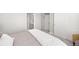 A bedroom offers a view of the en suite bathroom and features neutral walls and soft carpeting at 15608 E Otero Cir, Centennial, CO 80112