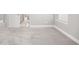 View of the bedroom space showcasing neutral walls, broad trim, and an entry to an en suite bathroom at 15608 E Otero Cir, Centennial, CO 80112