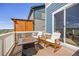 Cozy deck area featuring comfortable rocking chairs and a fire pit for relaxation and entertaining at 15608 E Otero Cir, Centennial, CO 80112
