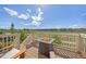 Spacious deck with a fire pit and scenic views, perfect for outdoor entertainment and relaxation at 15608 E Otero Cir, Centennial, CO 80112