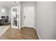 Entryway with hardwood floors and an office with glass doors at 15608 E Otero Cir, Centennial, CO 80112