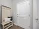 Inviting entryway with a coat rack, bench, and ample storage, offering a warm welcome to guests at 15608 E Otero Cir, Centennial, CO 80112