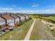 Aerial view of a 2-story home with a deck and patio in a Gathering-friendly neighborhood near a walking path at 15608 E Otero Cir, Centennial, CO 80112