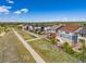 Aerial view of a 2-story home featuring a deck and patio in a neighborhood near a walking path at 15608 E Otero Cir, Centennial, CO 80112