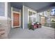 Inviting front porch with seating, showcasing a cozy outdoor space for relaxation at 15608 E Otero Cir, Centennial, CO 80112