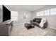 This living room features a neutral palette with a TV, comfortable seating, and natural light at 15608 E Otero Cir, Centennial, CO 80112