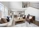 Spacious living room with an open-concept design, connecting the kitchen and dining area for seamless entertaining and relaxation at 15608 E Otero Cir, Centennial, CO 80112