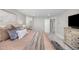 A spacious main bedroom featuring neutral walls, layered textures, an en suite bathroom and natural light at 15608 E Otero Cir, Centennial, CO 80112