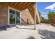 Ground level patio with sliding glass door access and a staircase leading to an upper level at 15608 E Otero Cir, Centennial, CO 80112