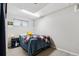 Cozy bedroom with a comfortable bed, soft lighting, and a convenient nightstand at 6537 S Brentwood Way, Littleton, CO 80123