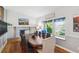 Charming dining area featuring a window seat, fireplace, and an elegant dining table for a cozy, inviting atmosphere at 6537 S Brentwood Way, Littleton, CO 80123