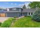 Charming two-story home with a well-maintained front yard, lush landscaping, and inviting curb appeal at 6537 S Brentwood Way, Littleton, CO 80123